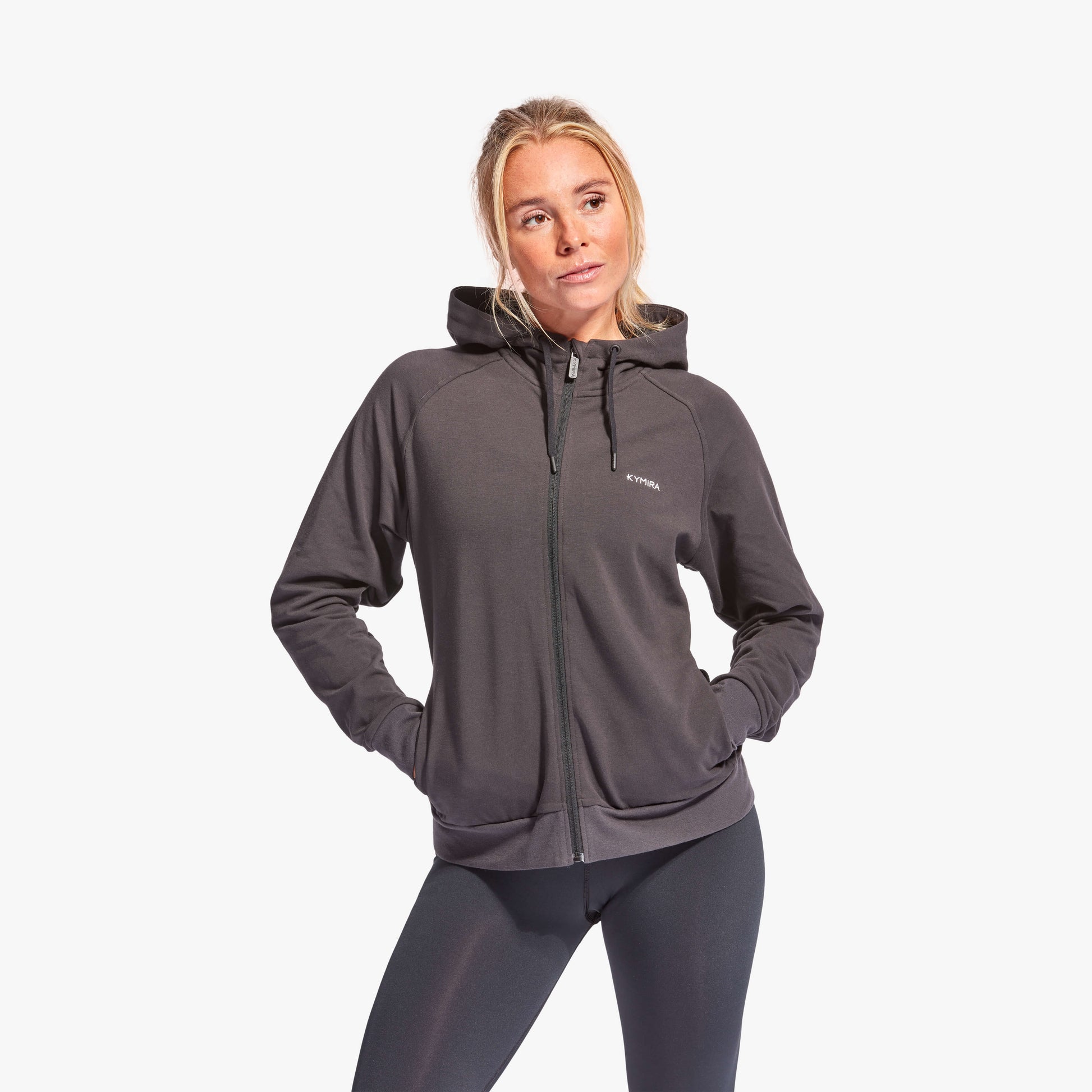 Elegant women’s Recharge tracksuit top by KYMIRA, featuring a luxurious full zip and comfortable drawstring hood, perfect for warm-ups and cool-downs.