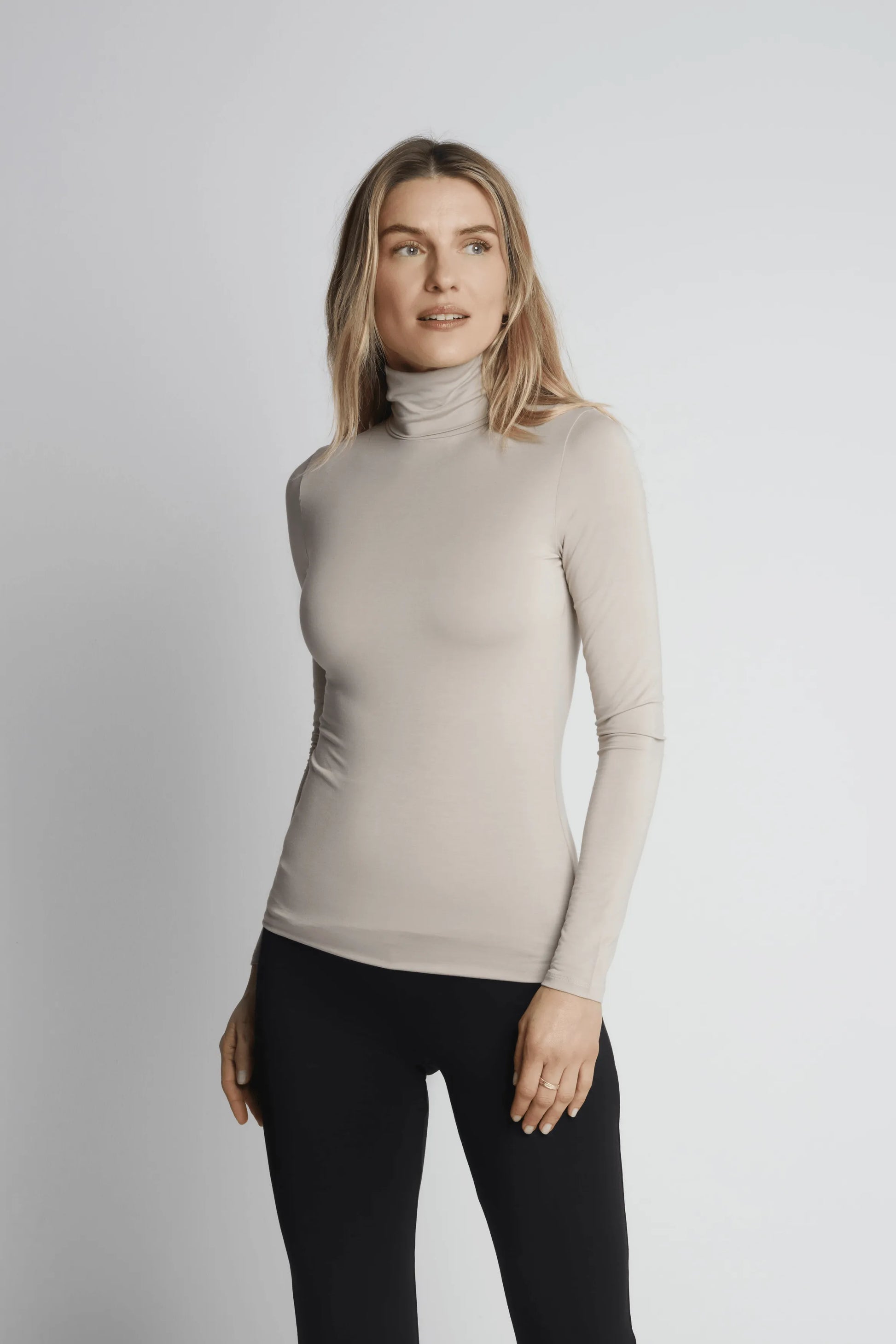 Elegant Women's Roll Neck TENCEL™ Micro Modal Top in luxurious soft fabric, perfect for layering or solo wear.