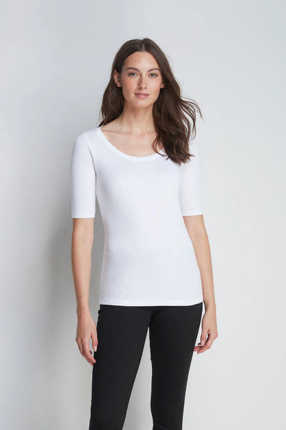 Luxurious women's half sleeve scoop neck t-shirt in premium cotton-modal blend, showcasing elegant draping and a flattering silhouette.