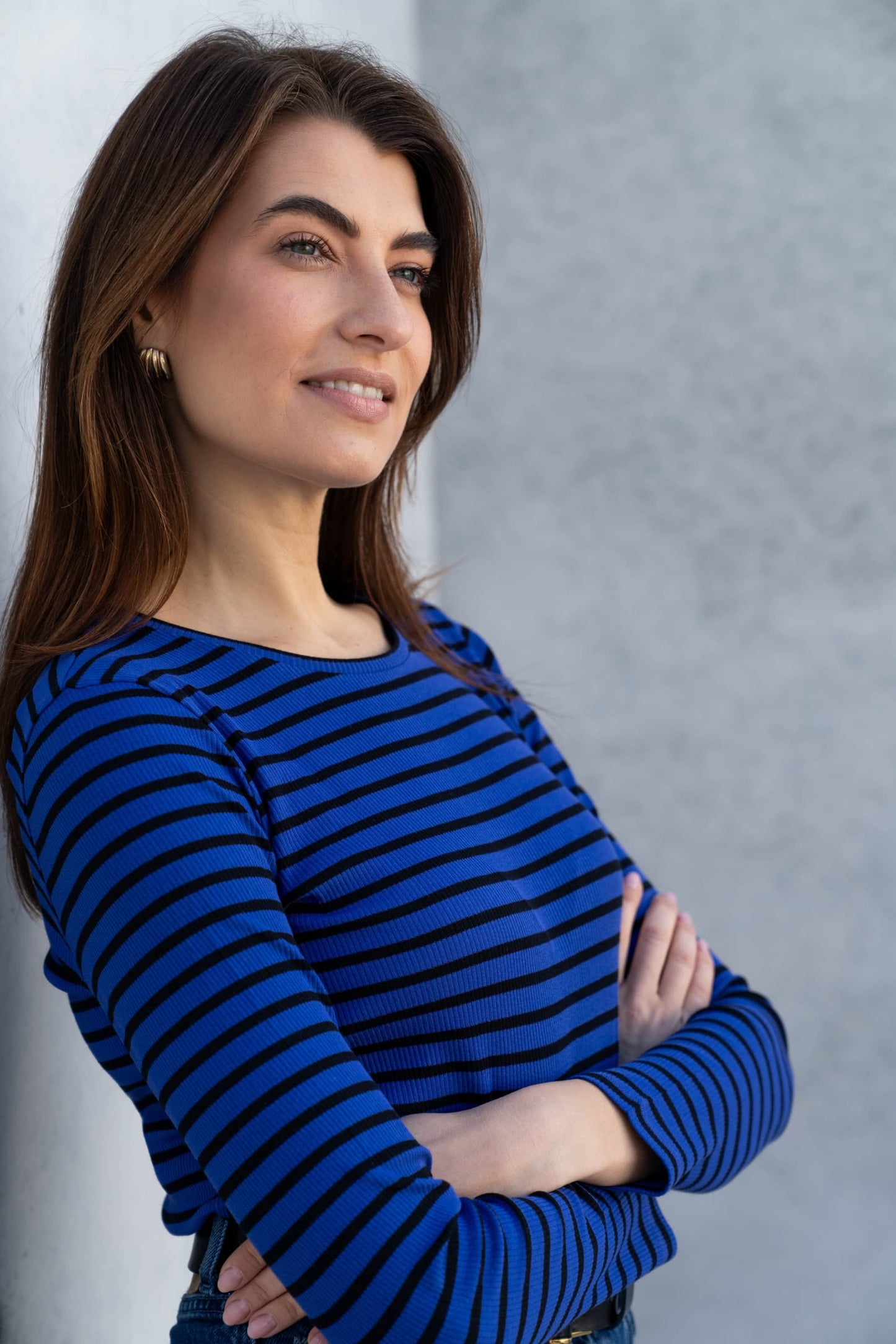 Close-up view of the soft organic cotton texture of the women's striped crew neck t-shirt, emphasizing its premium quality and comfort.