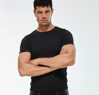 Elegant black men's compression t-shirt tailored for performance, featuring a flattering fit and luxurious fabric for gym enthusiasts.