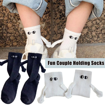 Elegant couple wearing Novelty Romantic Magnetic Holding Hands Couple Socks, showcasing a playful design with 3D elements, perfect for expressing romantic connections.