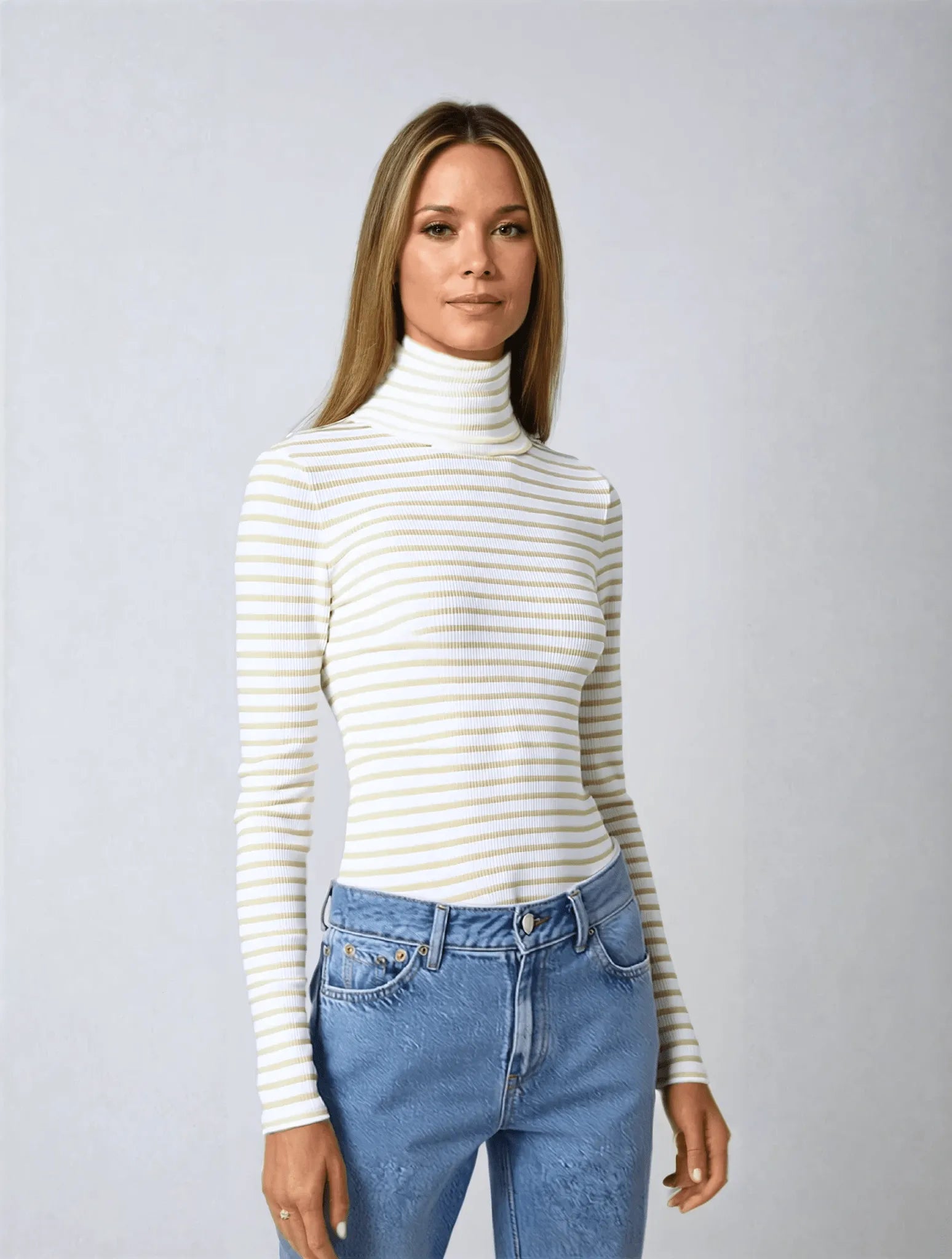 Elegant women's long sleeve cotton roll neck top displayed with tailored trousers, showcasing a polished, luxurious look.