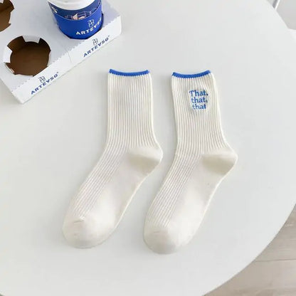 Elegant White Embroidered Socks for Women with Unique Japanese-Style Font Design highlighted by vibrant blue, enhancing your fashion statement effortlessly.
