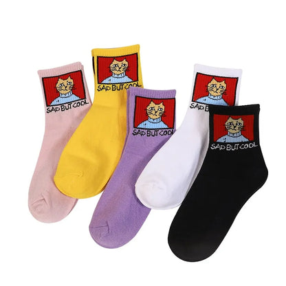 Stylish Hip Hop Long Socks for Women & Girls featuring a playful 'SAD BUT COOL' cartoon design. Available in vibrant colours including yellow, pink, purple, white, and black, crafted from a luxurious cotton and polyester blend for ultimate comfort and durability.
