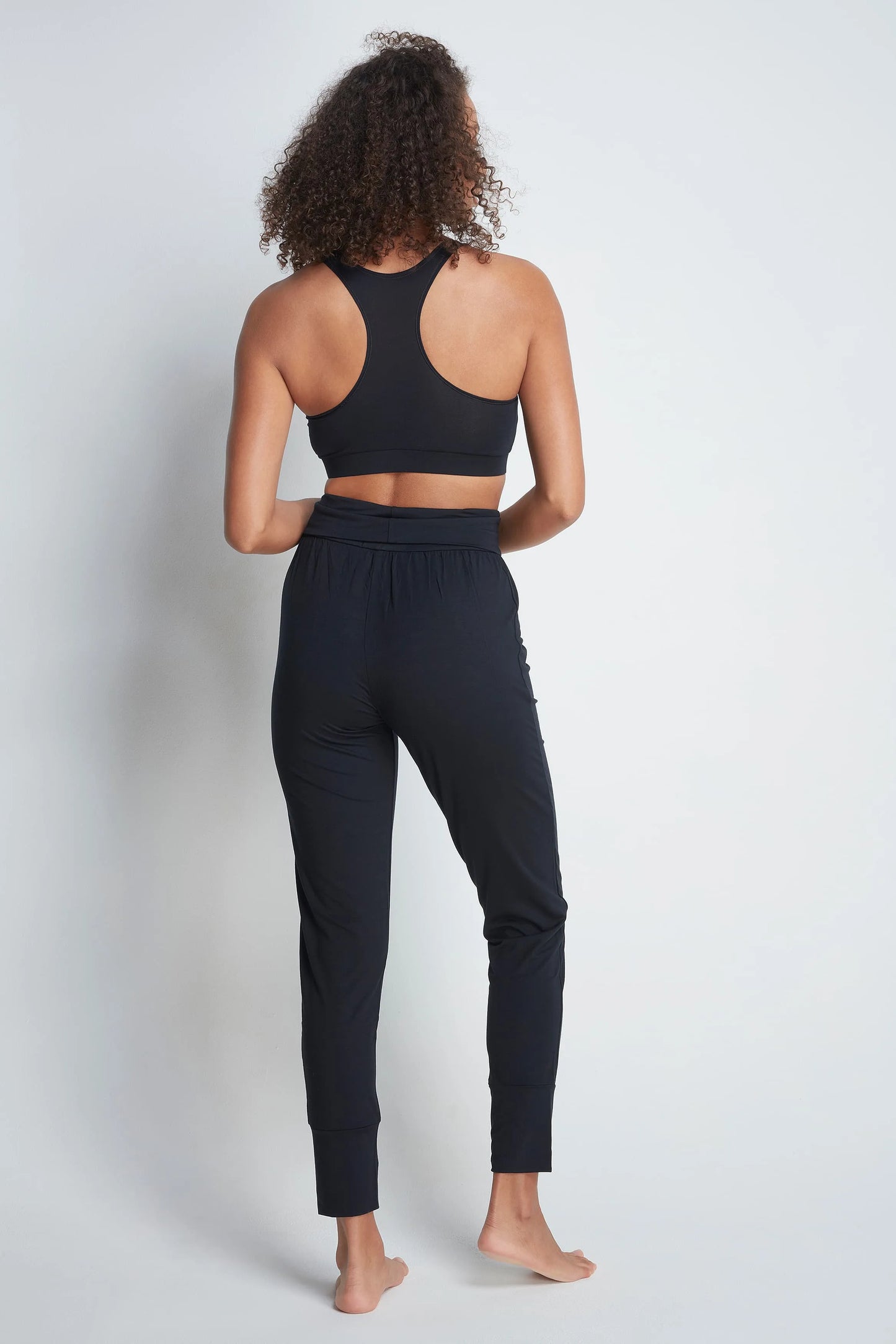 Close-up of the elasticated waistband on luxurious women's micro modal yoga trousers, highlighting the comfort and flexibility for daily wear and yoga practice.