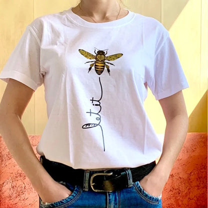 Model wearing Bee Kind Women's Graphic Tee styled with casual summer outfit, created by Dazzling Dreams Studio, embodying elegance and kindness.