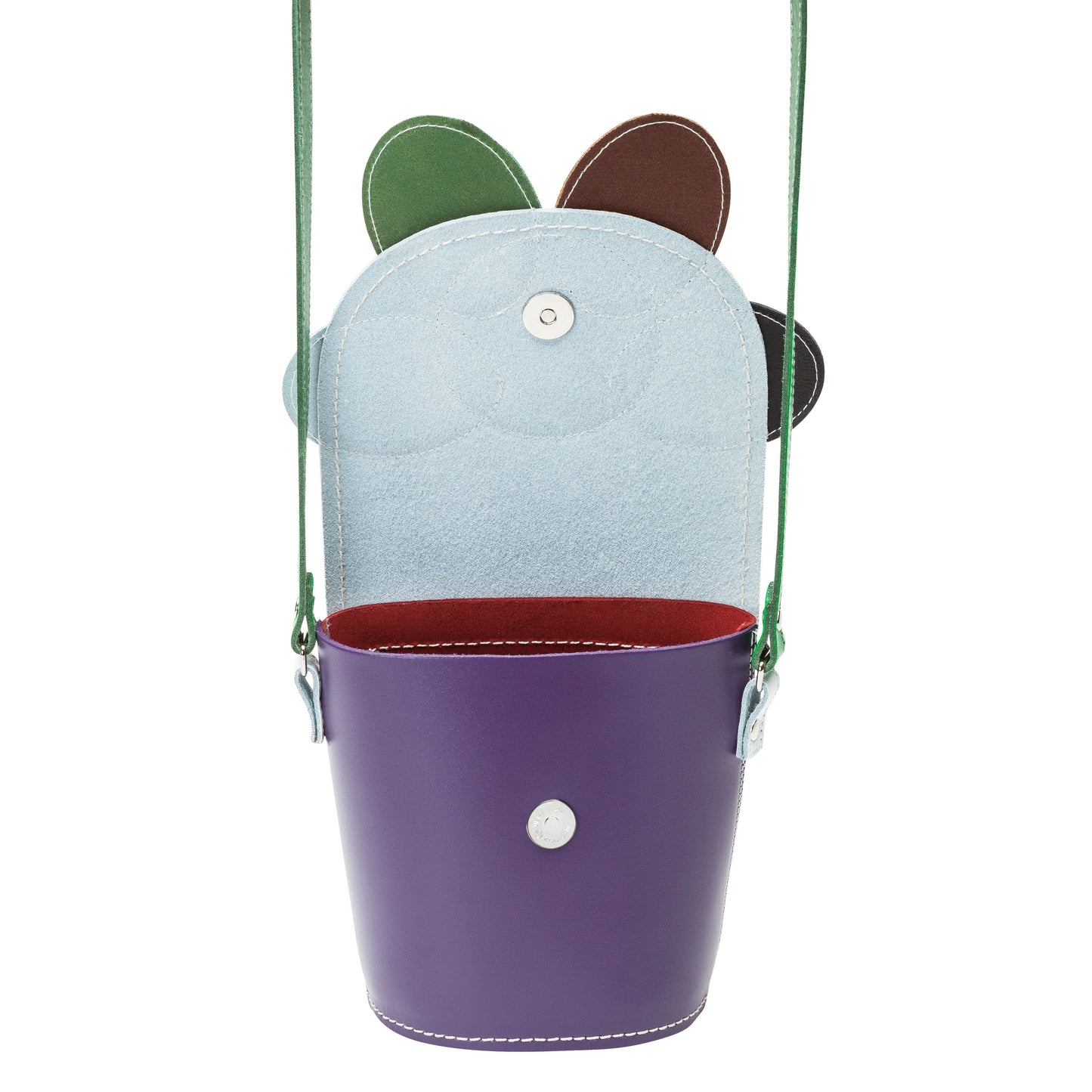 Handmade Leather Daisy Barrel Bag featured in an elegant setting, representing a luxurious accessory for fashion-forward individuals.