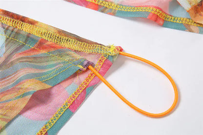 Delicate floral detailing on the sheer mesh overlay of the Floral Mesh Skirt Set designed by Dazzling Dreams Studio, exuding feminine charm.