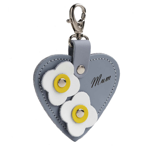 Handmade lilac grey leather love heart bag charm with 'Mum' engraving and delicate flower appliques, perfect for adding a touch of elegance to any handbag.
