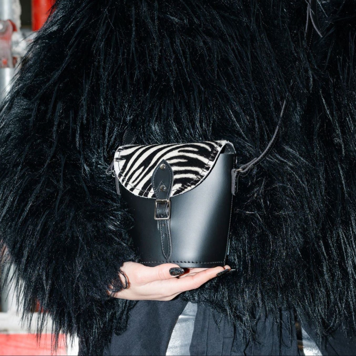 Luxurious Handmade Leather Barrel Bag in Zebra Print, showcasing its unique design and premium quality craftsmanship, adjustable strap for versatile wear.