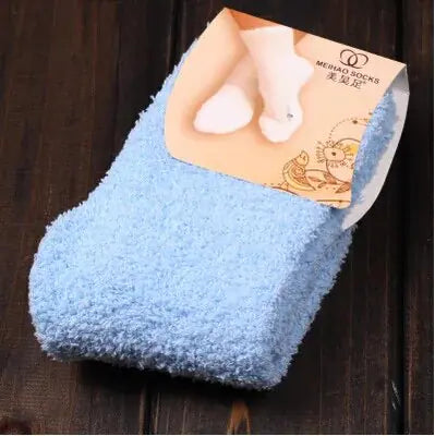 Chic Women's Bed Socks in calming blue, made from fluffy coral fleece to provide unmatched comfort and warmth this winter season.