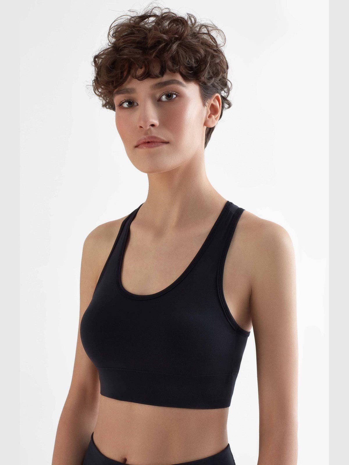 Eco-friendly women's sports bra crafted from 94% recycled polyester, featuring a luxurious, moisture-regulating design and wide double-layered straps for ultimate comfort during workouts and everyday wear.