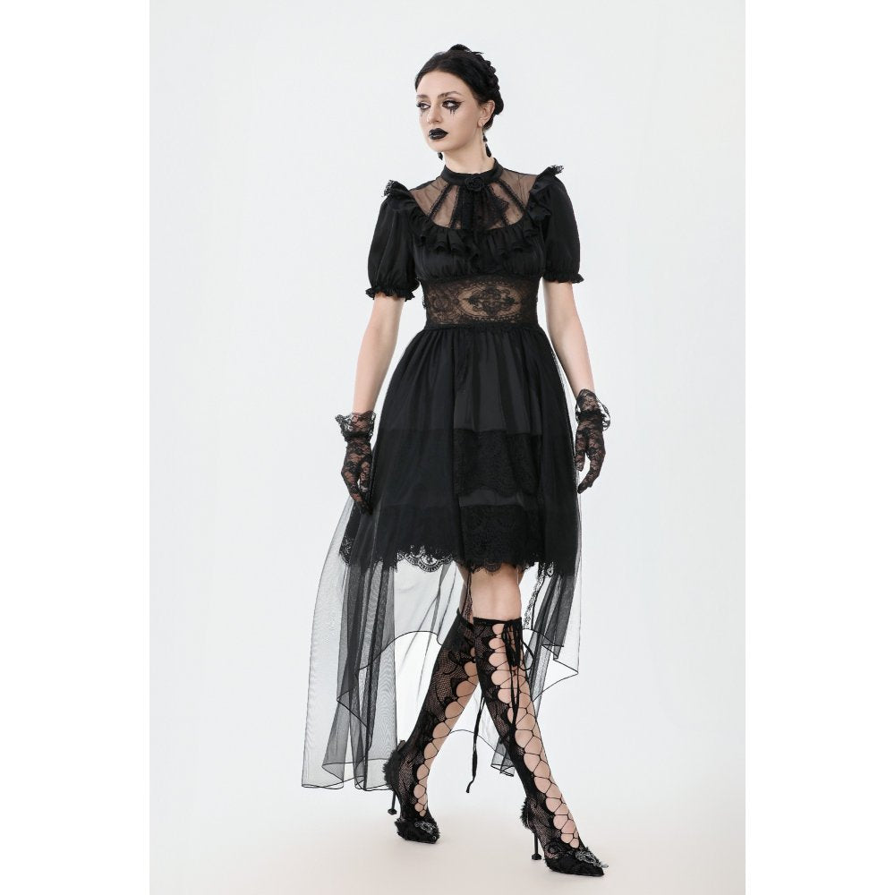 Model wearing the Dark in Love Ebon Rose dress with puff sleeves at a gothic tea party setting.