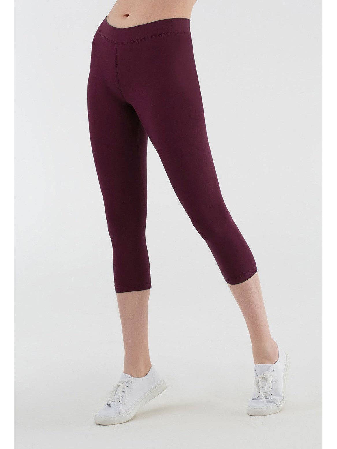 Lifestyle image of women wearing organic cotton leggings, demonstrating freedom of movement and luxurious comfort in daily wear.