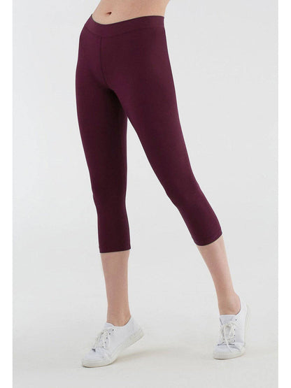 Lifestyle image of women wearing organic cotton leggings, demonstrating freedom of movement and luxurious comfort in daily wear.
