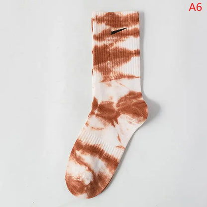 Luxurious Women's Tie-Dye Middle Tube Socks showcasing a striking tie-dye pattern in shades of orange and white, designed to enhance your wardrobe with vibrant comfort and style.