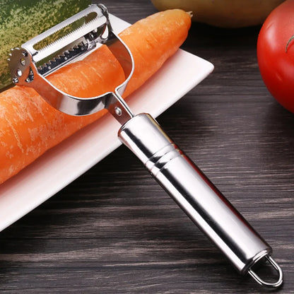 Elegant Precision Julienne Stainless Steel Peeler positioned near fresh vegetables, highlighting its polished chrome finish and ergonomic design for effortless kitchen use.