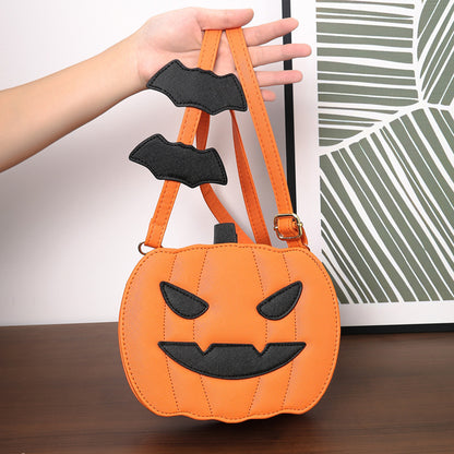2023 Halloween Bags Funny Pumpkin Cartoon Shoulder Crossbody Bag featuring a vibrant orange pumpkin shape held by an elegant hand, ideal for Halloween festivities.