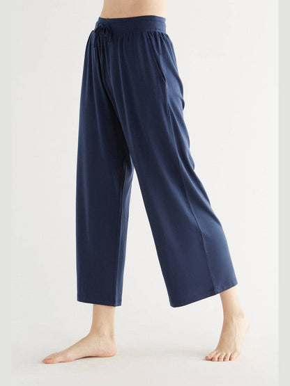 Luxurious Tencel wide leg trousers for women, featuring a flowing silhouette and eco-friendly fabric.