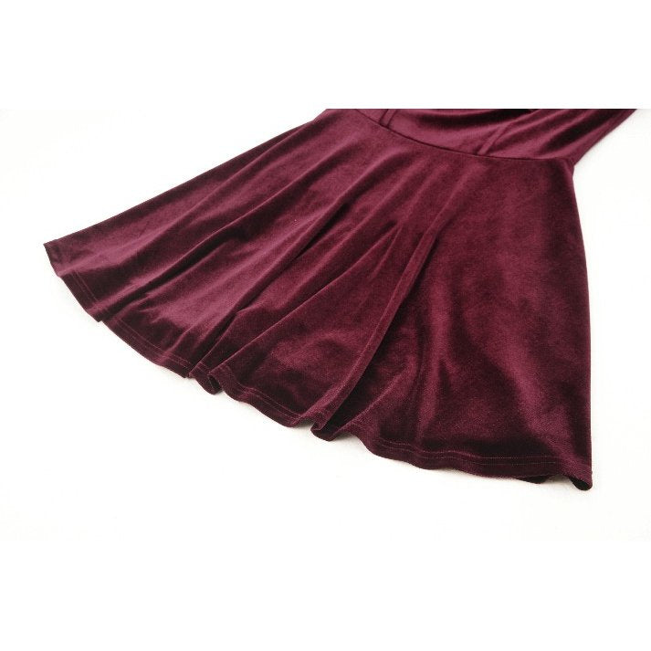 Close-up of the detailed black gothic lace and gently belled sleeves of the burgundy velvet dress by Dark in Love.