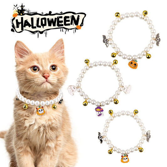 Luxury Pet Pearl Necklace Decoration Halloween Cat Collar featuring a playful orange pumpkin charm, a ghost charm with a witch hat, and shiny gold bells, perfect for stylish cats this Halloween season.