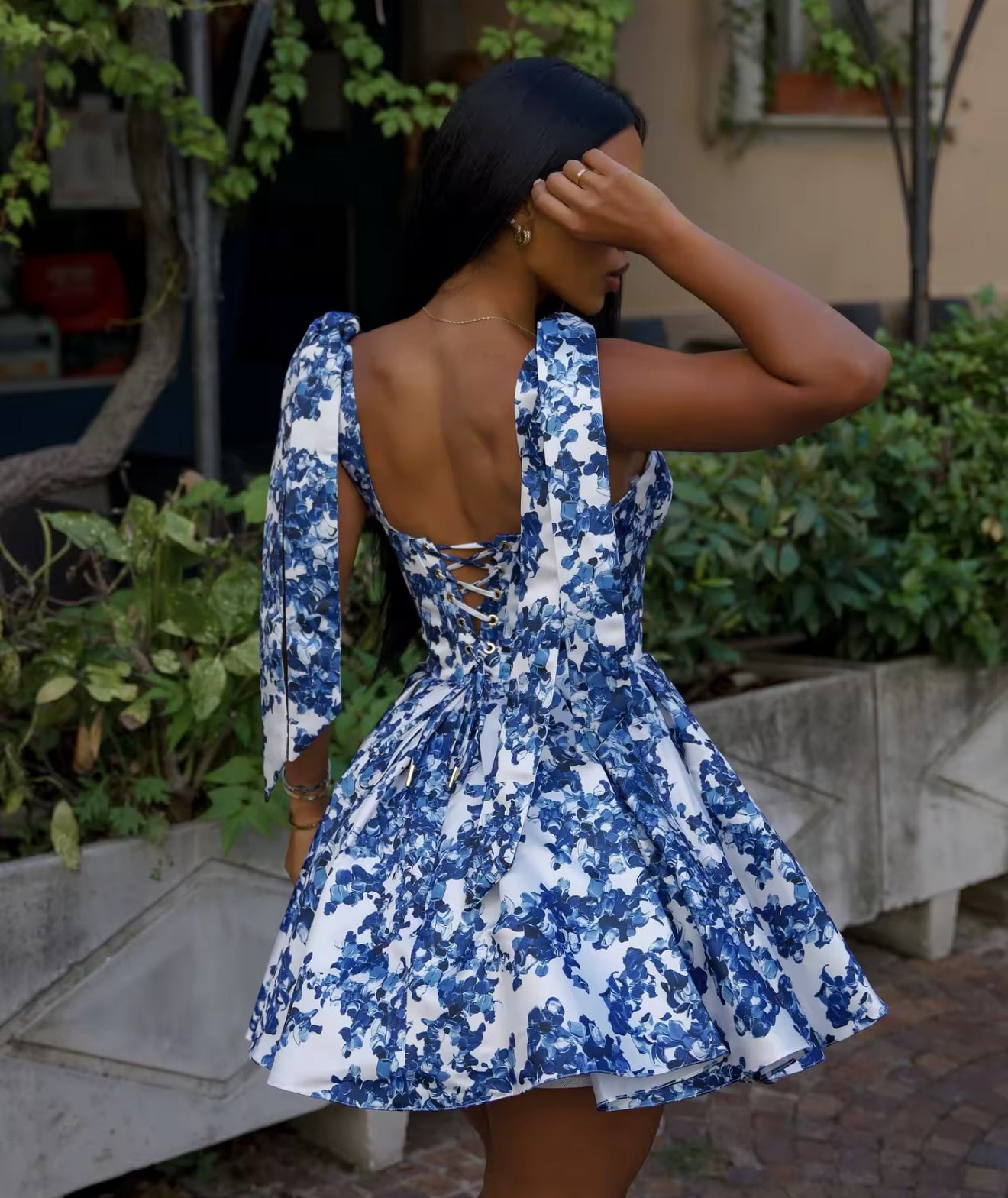 Charming Aegean dress from Girl In the Mirror collection, showcasing a low cut corset tie back and delicate bow tie straps, available in sizes S to L.