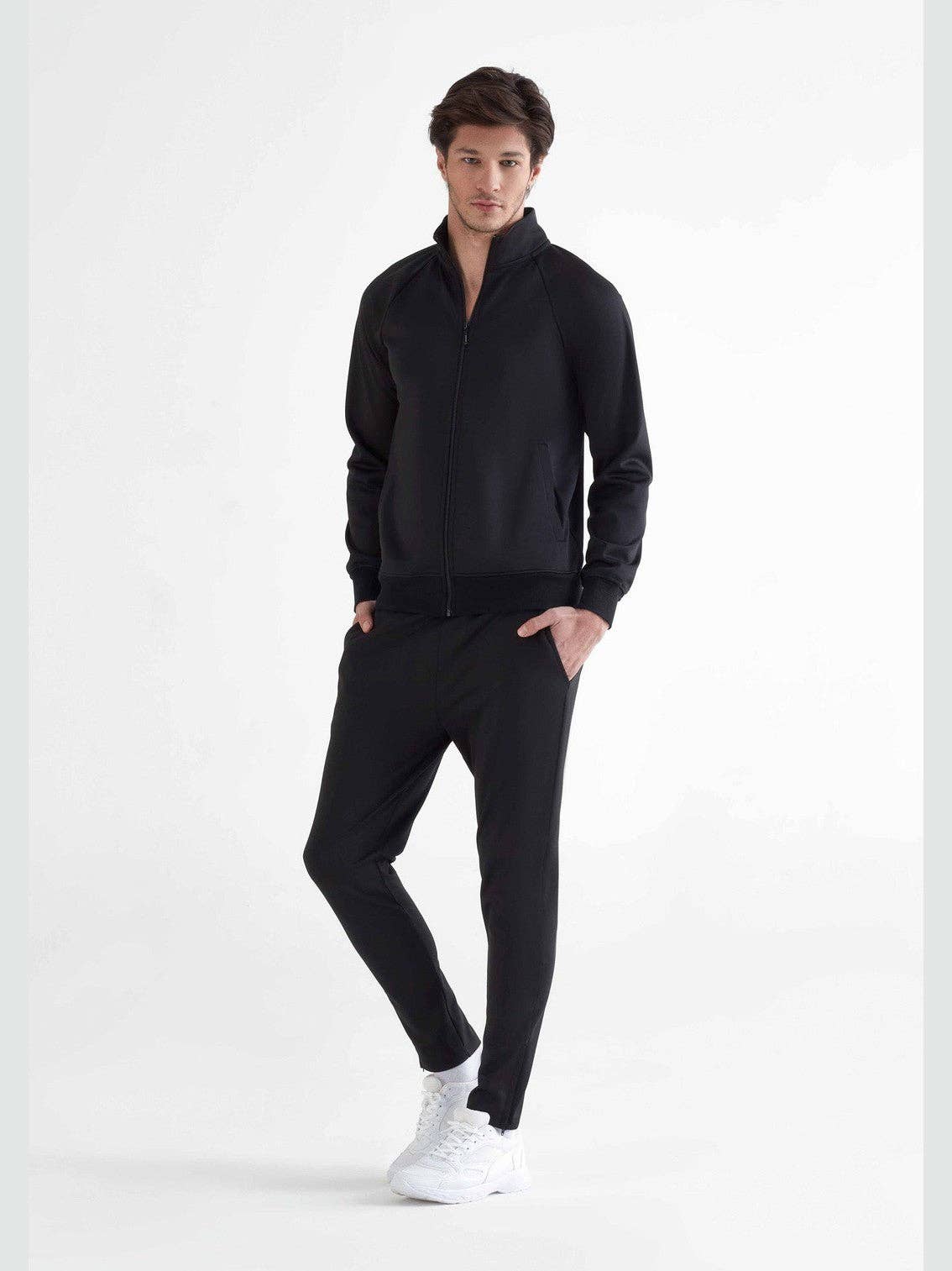 Elegant Men's Eco-Friendly Sports Sweatpants with moisture control technology, showcasing a classic tapered design and stylish zippers for a sophisticated athleisure look.