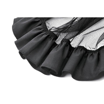 Dramatic side view of the Belladonna Mesh Skirt in black, demonstrating the romantic layering of sheer mesh and solid panels.