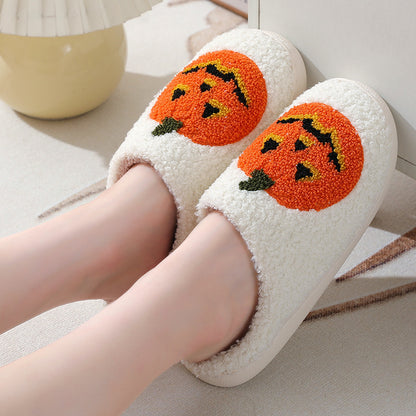 Refined Halloween Pumpkin Cartoon Slippers in white, designed with a plush pumpkin illustration, offering warmth and whimsical flair for stylish loungewear.