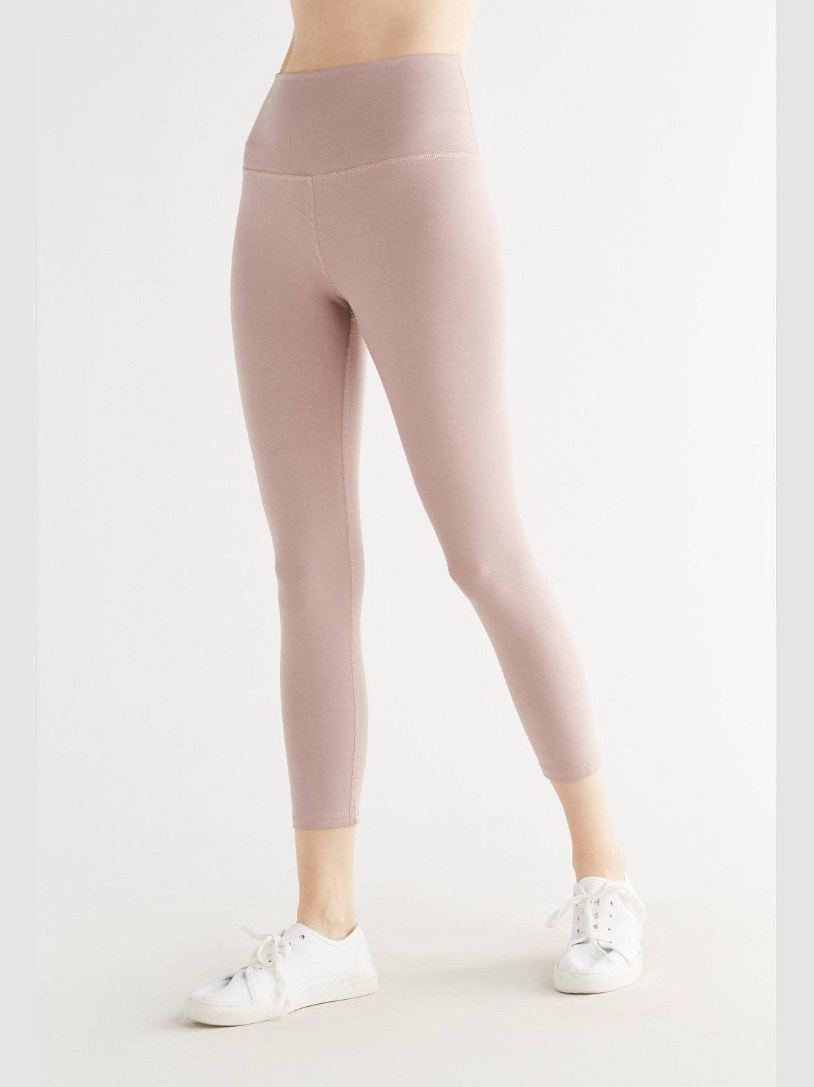 Fit guide for luxury high-rise stretch leggings showing snug form-fitting design, ideal for a sculpted silhouette.