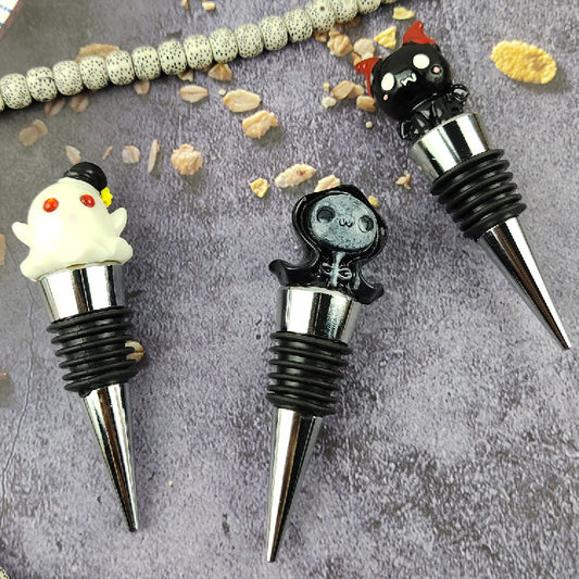 Close-up of three enchanting Halloween Sealed Stopper Vacuum Resin Wine Bottle Stoppers in whimsical shapes, ideal for sophisticated Halloween celebrations, adding a touch of glamour and uniqueness.