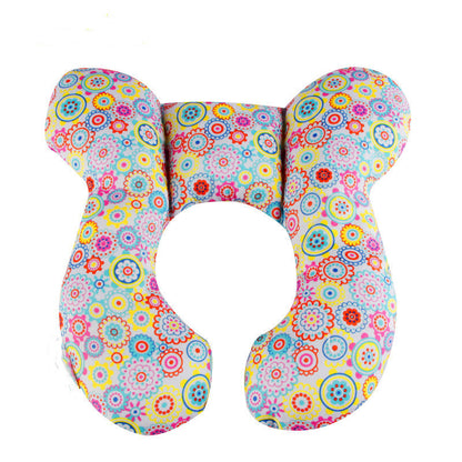 Charming U-Shaped Infant Pillow by Dazzling Dreams Studio with a colourful floral pattern, designed to enhance comfort and style for your baby's resting experience.