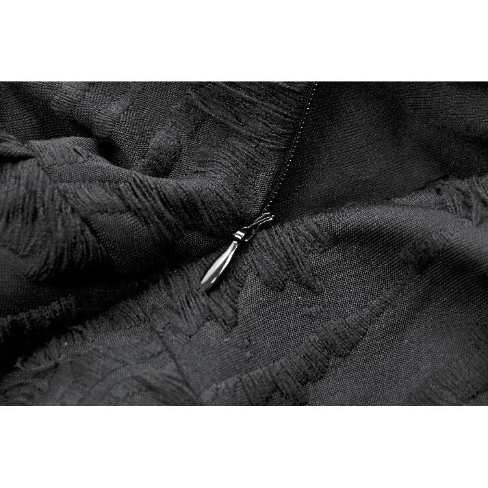 Flared skirt of the Dark in Love Mortalis dress showcasing the asymmetric spiderweb lace hem detail.