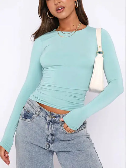 Elegant slim-fit long sleeve women's tee by Dazzling Dreams Studio, showcasing modern streetwear style and luxurious fabric.