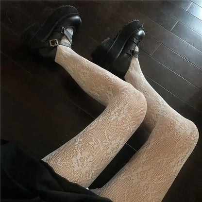 Women's Luxury Fishnet Design Tights displayed elegantly with stylish black platform shoes, capturing a chic and fashionable look perfect for any occasion.
