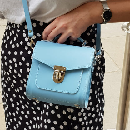 Handmade Pastel Baby Blue Leather Sugarcube Handbag showcasing premium craftsmanship, perfect for stylish outings and featuring adjustable straps and multiple sizes.