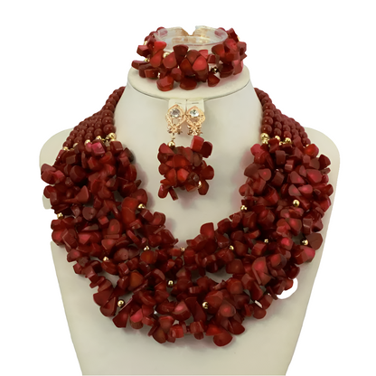 Complete African coral beads jewelry set displayed elegantly, including necklace, earrings, and bracelet, perfect for brides and anniversaries.
