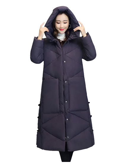 Beautifully styled long snow jacket for women, featuring a hood and multiple pockets, ideal for cold weather elegance.