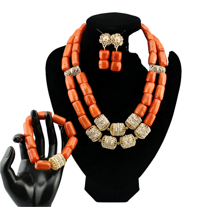 Complete luxury coral bead jewellery set featuring a necklace, earrings, and bracelet, perfect for enhancing personal style at weddings and festive events, with a touch of African elegance.