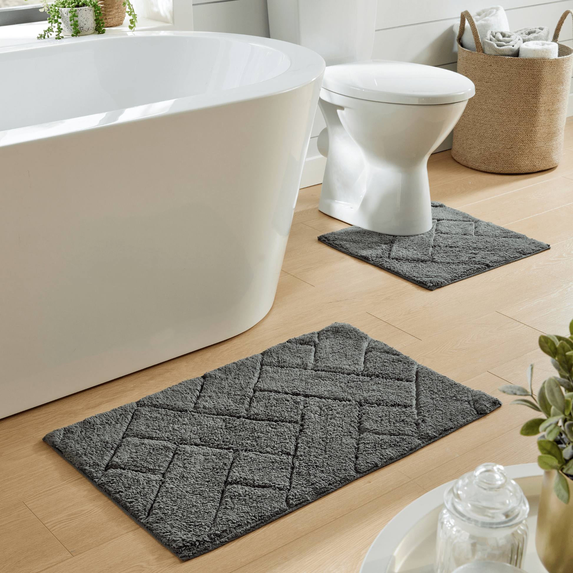 Luxurious Bali Bath Mat & Pedestal Set by OLIVIA ROCCO displaying premium 100% cotton fabric, showcasing elegance and sophistication in a stylish bathroom setting.