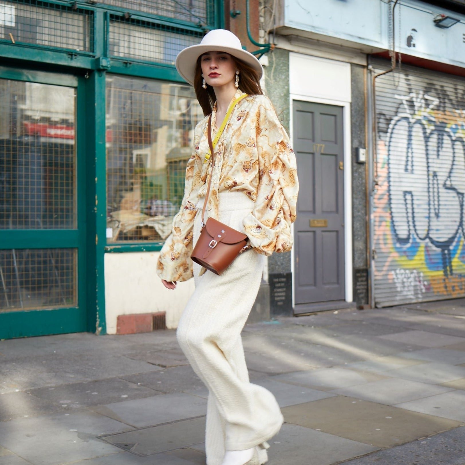 Interior view of the Handmade Leather Barrel Bag, illustrating ample space and personalised engraving options, designed for modern luxury and sophistication.