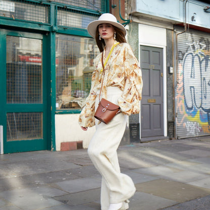 Personalisation options for the Handmade Lilac Grey Leather Barrel Bag, including magnetic fastening and internal engraving for a unique touch.