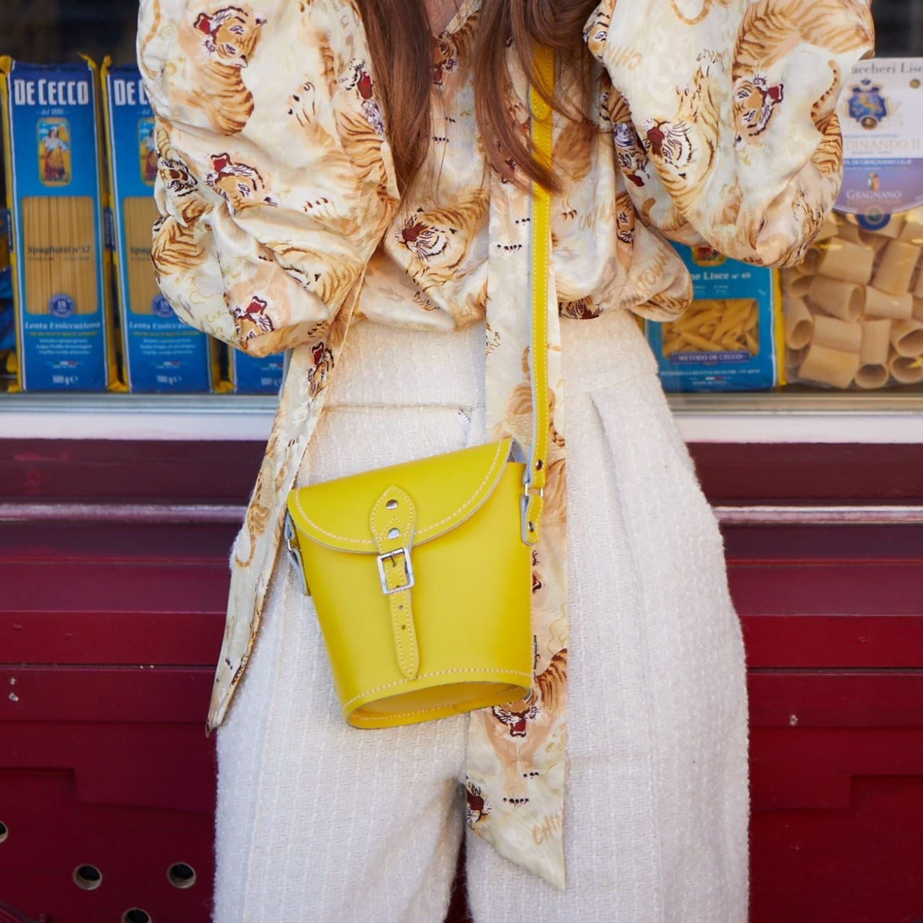 Interior view of Handmade Pastel Baby Blue Leather Barrel Bag, featuring ample space for essentials and exquisite matching stitch detailing.