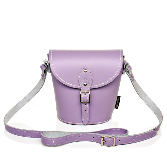 Handmade Pastel Violet Leather Barrel Bag showcasing luxury craftsmanship with adjustable strap and personalised engraving option, perfect for modern elegance and stylish outings.