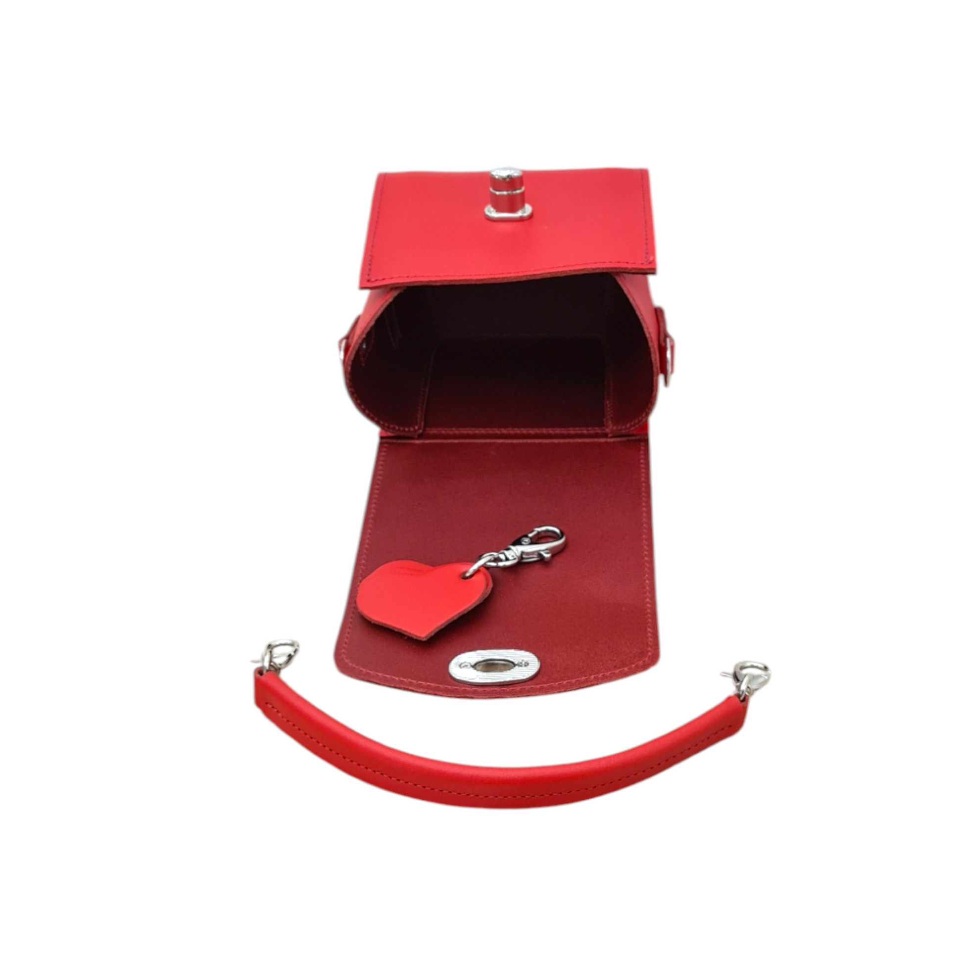 Close-up of the exquisite craftsmanship of the Handmade Bauble Leather Handbag in Pillar Box Red, showcasing the elegant heart charm detail and premium leather texture.