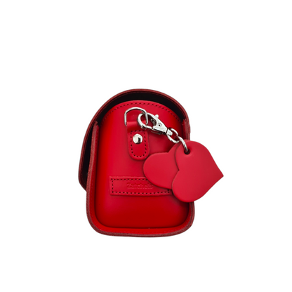 Versatile carrying options of the Handmade Bauble Leather Handbag, featuring a short grab handle and an adjustable cross-body strap, perfect for fashionable convenience.