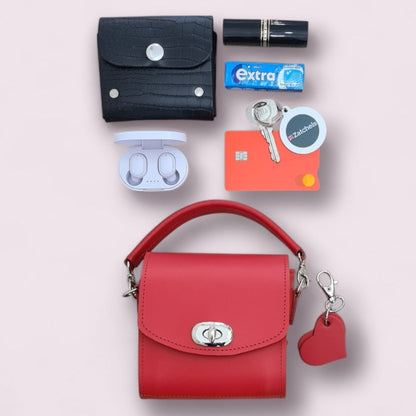 Luxury Handmade Bauble Leather Handbag in Pillar Box Red, featuring a heart charm, measuring 12cm x 11.5cm x 9cm - a chic accessory ideal for any occasion.