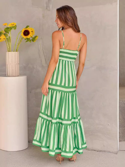 Elegant view of the back of a summer striped printed suspender long dress with pockets, highlighting the smocked back and delicate straps. Ideal for stylish summer outings and beach vacations.