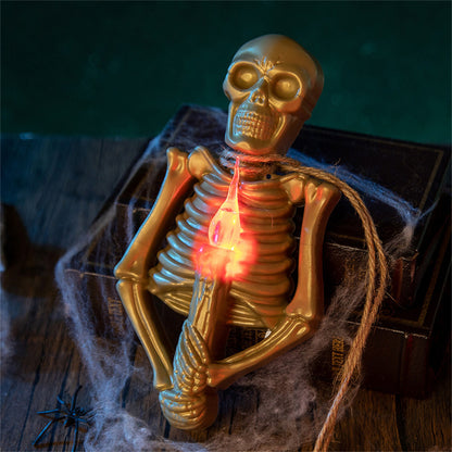 Gold skeleton holding a glowing candle designed as part of the Halloween Skull Candlestick Lamp, adding an exquisite touch of luxury to your Halloween décor.